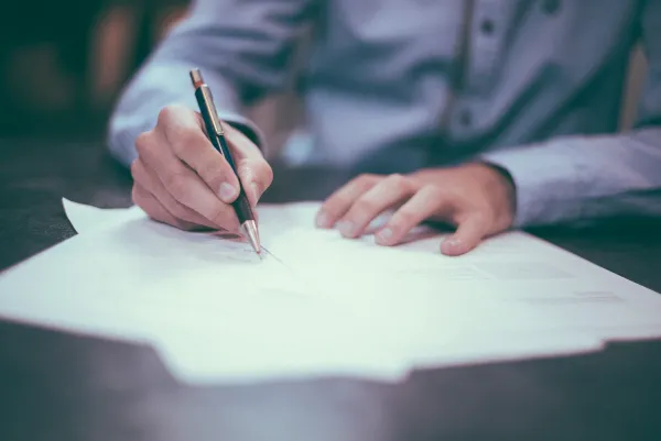 Signing a debt consolidation loan agreement with Charter Funding