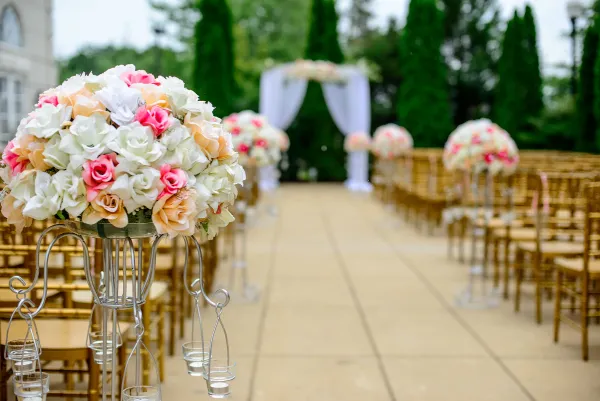Wedding aisle decorated with flowers, funded by a Charter Funding personal loan